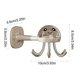 thumbnail image 3 of Estante de pared para cocina con forma de pulpo | Organizador adhesivo multigancho sin necesidad de taladrar | Ganchos giratorios de 360 grados para utensilios, toallas y llaves, 3 of 7