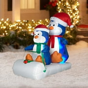 Angle View: 4' Tall x 3' Long Airblown Penguins on Sled Christmas Inflatable
