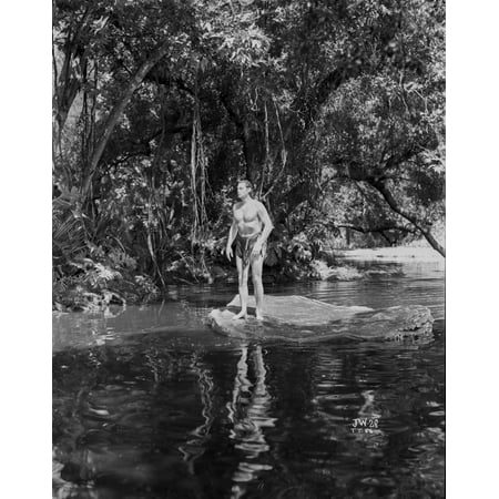 Johnny Weissmuller standing on a Rock in the River in a Classic Movie Scene Photo