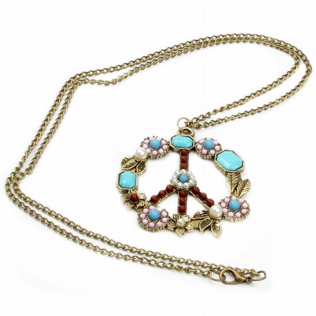 Collar con cuentas y flores con signo de la paz y piedras preciosas de color turquesa