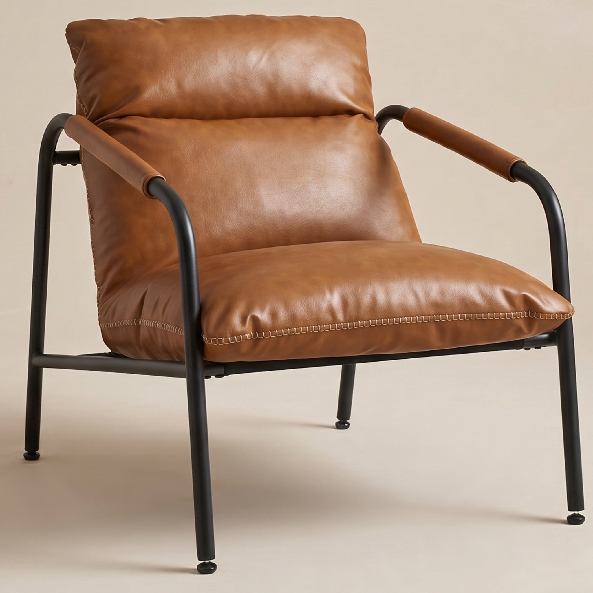 Nordic Hygge Mid-Century Modern Sling Armchair with Caramel Brown Synthetic Leather, Decorative Stitching, and Sturdy Metal Frame