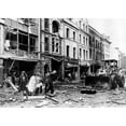 thumbnail image 2 of A Bulldozer Clears Away Debris In A Devestated Shopping Area Following The Explosion Of A 250-Pound Bomb History (, 2 of 2