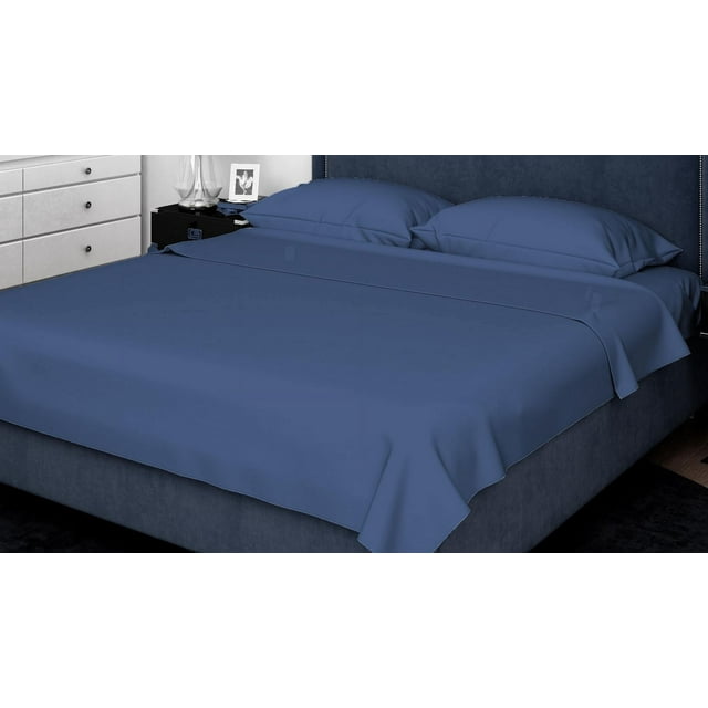 Blue 300 TC combed cotton sheet set with pillowcases on bed in contemporary bedroom.