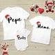 thumbnail image 1 of Camisetas a juego con gorro de Papá Noel para la familia, ropa a juego para madre, padre e hijos, camisetas para fiestas navideñas, atuendos para vacaciones de invierno, 1 of 5