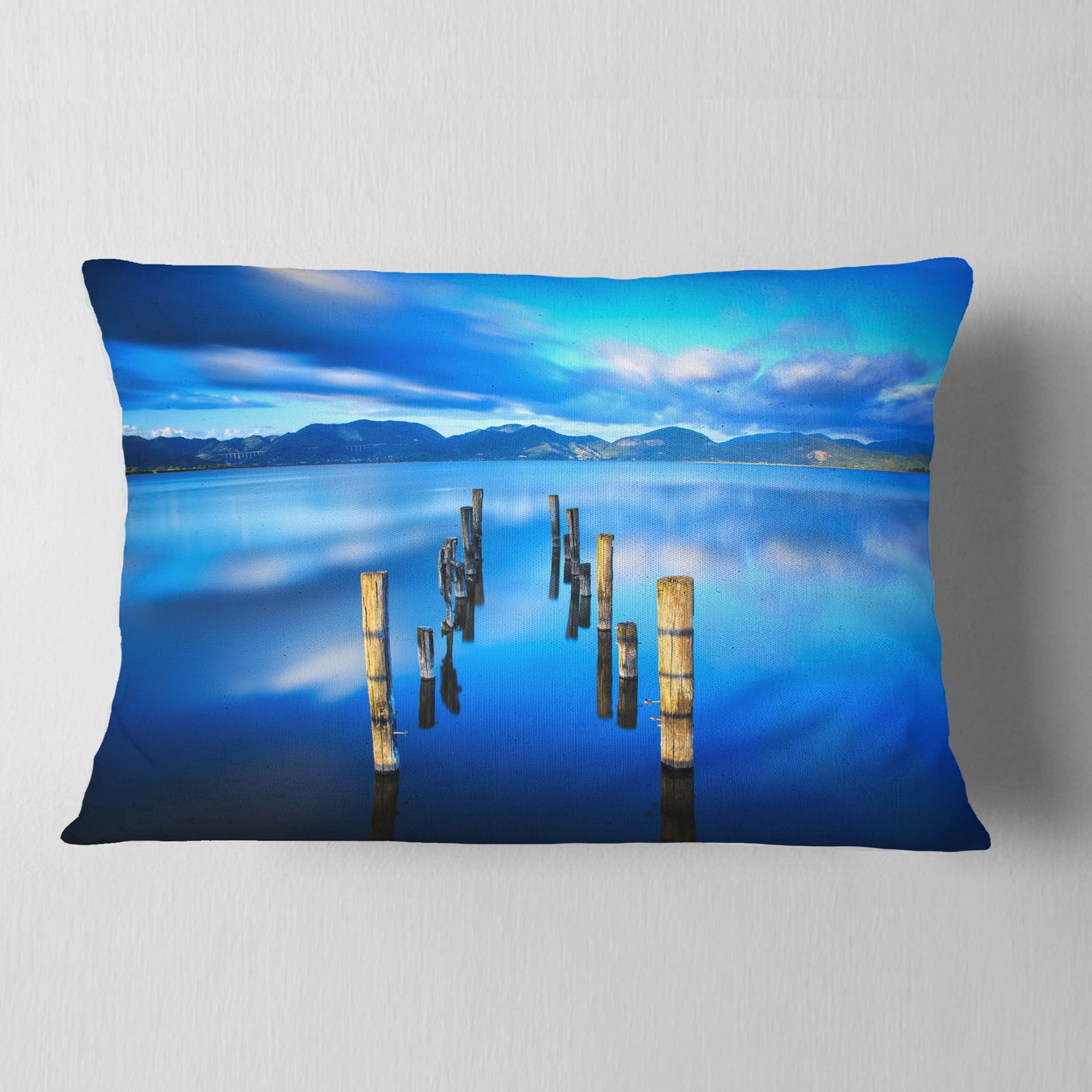 Designart Wooden Pier Remains in Blue Sea - Seascape Throw Pillow - 12x20