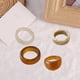 thumbnail image 4 of Conjunto De Anillos De Resina De Colores Ajustable Chica 4 piezas marrón beige. Hugo Anillos abiertos, 4 of 7