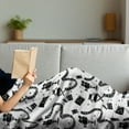 thumbnail image 3 of Old Hollywood Soft Flannel Fleece Throw Blanket, Cartoon Style Doodle Movie Cinema Elements and a Play Button, Cozy Plush for Indoor and Outdoor Use, 60" x 80", Black and White, by Ambesonne, 3 of 5