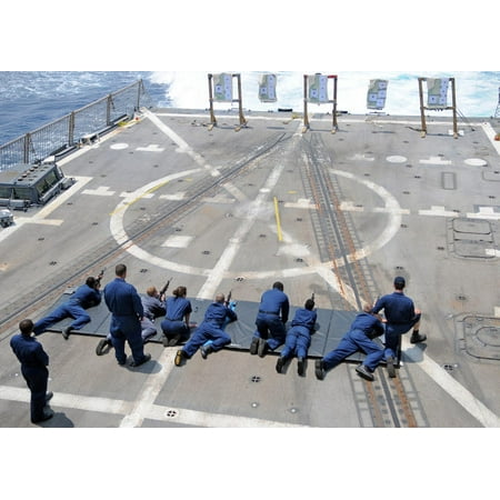 M4a1 Machine - Sailors fire M4A1 carbine assault rifles aboard USS Halsey Poster Print by Stocktrek Images