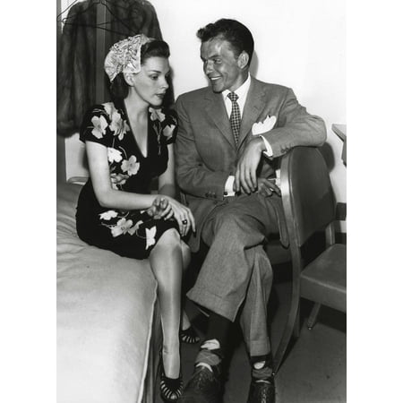 - Frank Sinatra and Judy Garland sitting on a bed Photo Print