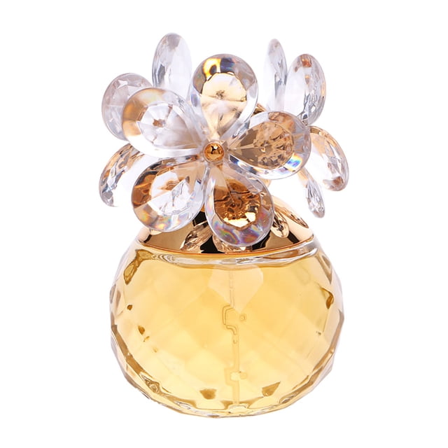 perfume de mujer zulema espray de encanto portátil amarillo 60ml botella de vidrio facetada amarilla 60 ml con tapa en forma de flor transparente y detalles dorados, vista frontal, altura 95 mm (3.74 in), uso en cuello y muñecas según descripción; a menudo usado como regalo compacto.