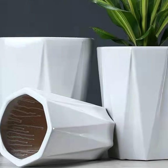 Ceramic vase, white, octagonal shape, round and delicate design along the mouth.