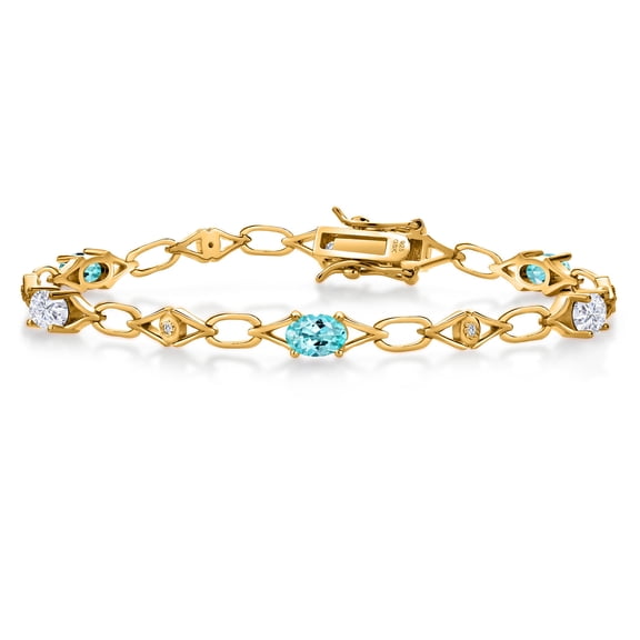 Gem Stone King 18K Yellow Gold Plated Silver Blue Apatite and White Moissanite and Round White Lab Grown Diamond Tennis Bracelet for Women (3.11 Cttw, Gemstone Birthstone, Oval 6X4MM, 7.25 inches)