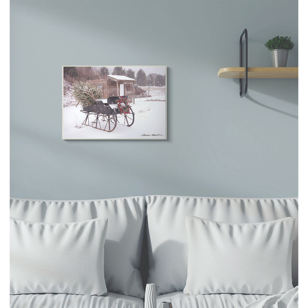 The Stupell Home Decor Collection Snow Sleigh with Tree and Wreath Photograph Wood Wall Art
