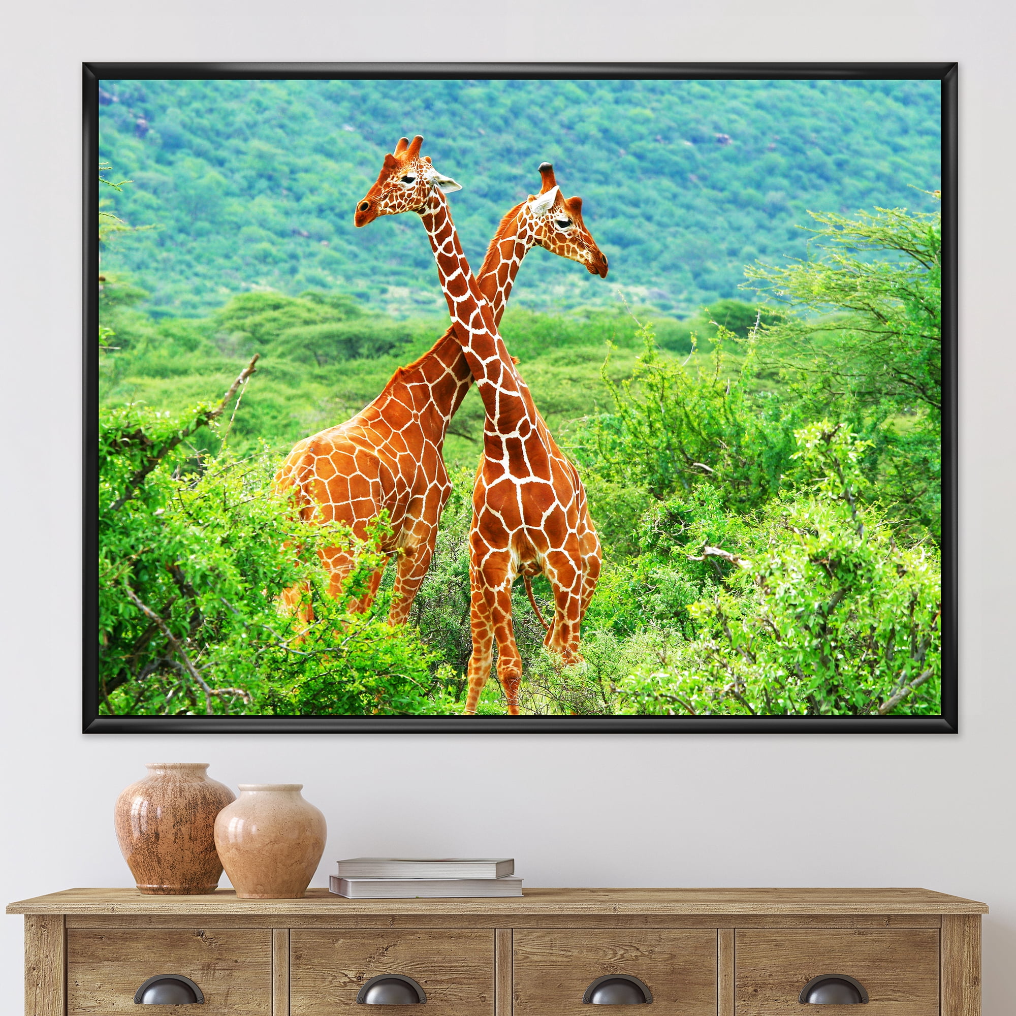 Two Giraffes Fighting In Lush Green Wild 20 in x 12 in Framed Painting Canvas Art Print, by Designart