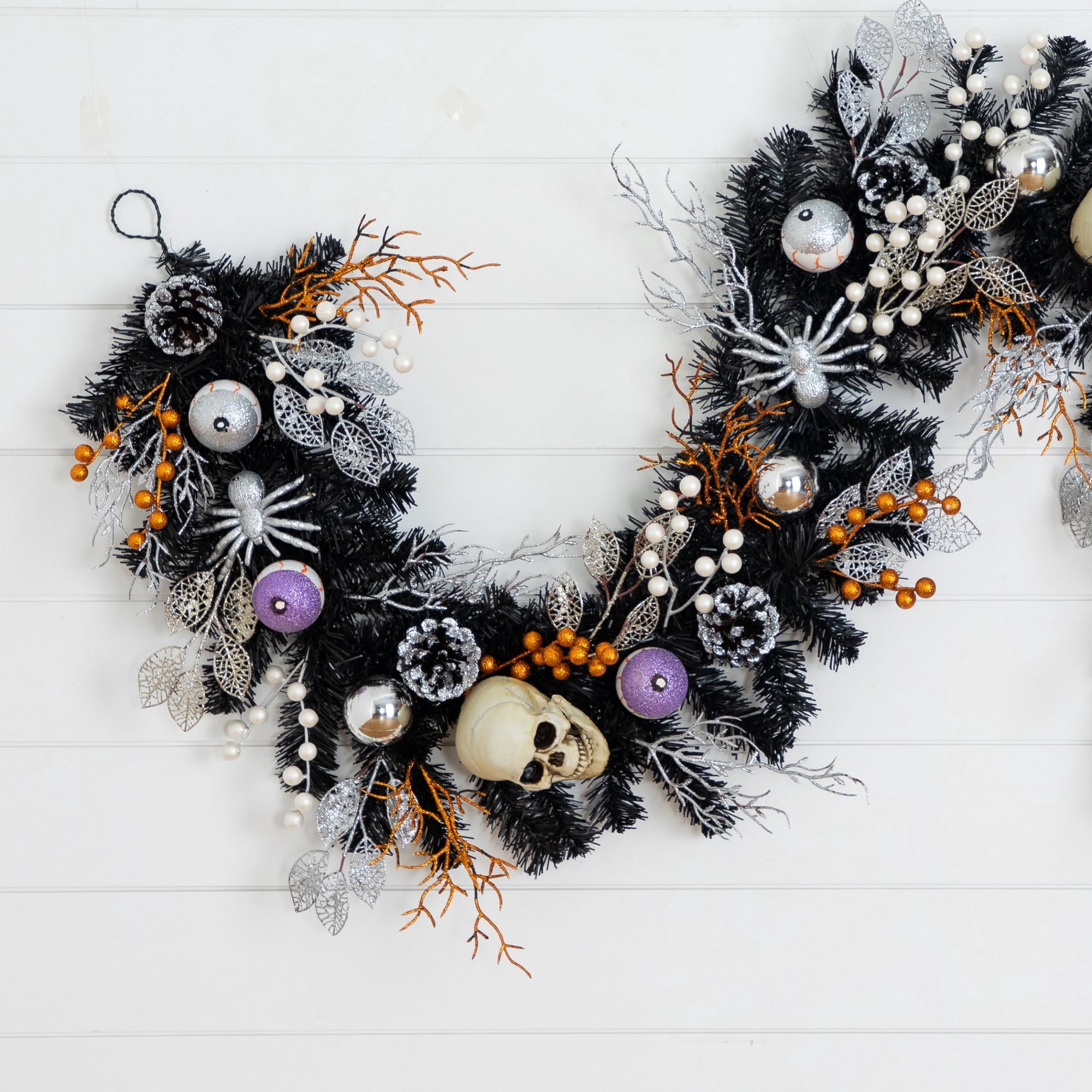6ft. Artificial Halloween Black Garland with Skulls, Eyeballs and Spiders