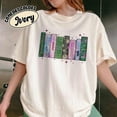 thumbnail image 2 of Wicked Book Shelf Tee | Light Green Vintage Graphic Shirt | Broadway-Inspired Pastel Book Stack Top, 2 of 4