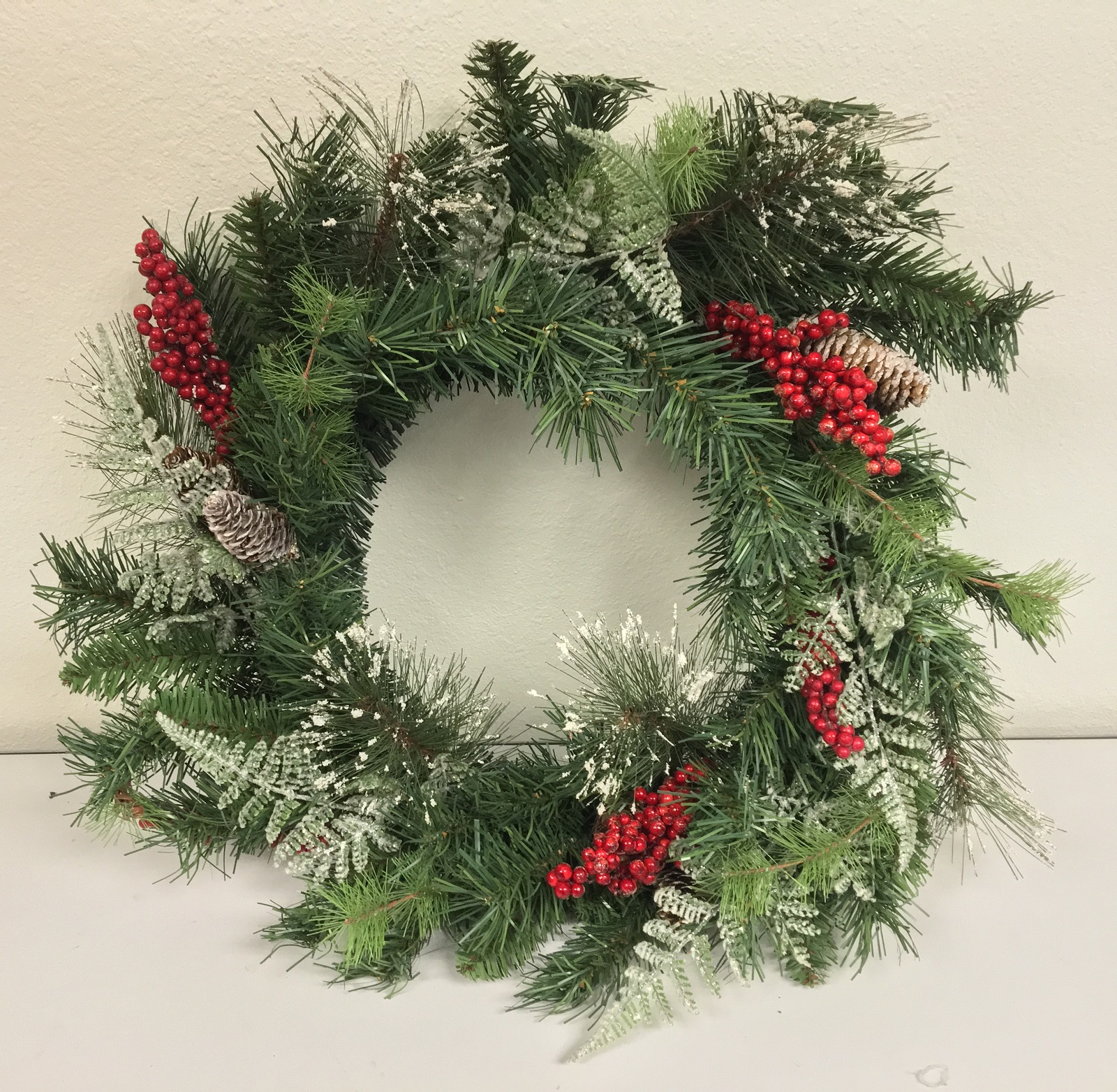 8 disney gifts ideas Red Berries and Frosted Fixed Pine 24 Inch Christmas Wreath Handing