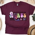 thumbnail image 1 of Emergency Nurse T-Shirt | Pastel Lettering with Stethoscope and Checkered Print Tee, Maroon, Size XL, 1 of 6
