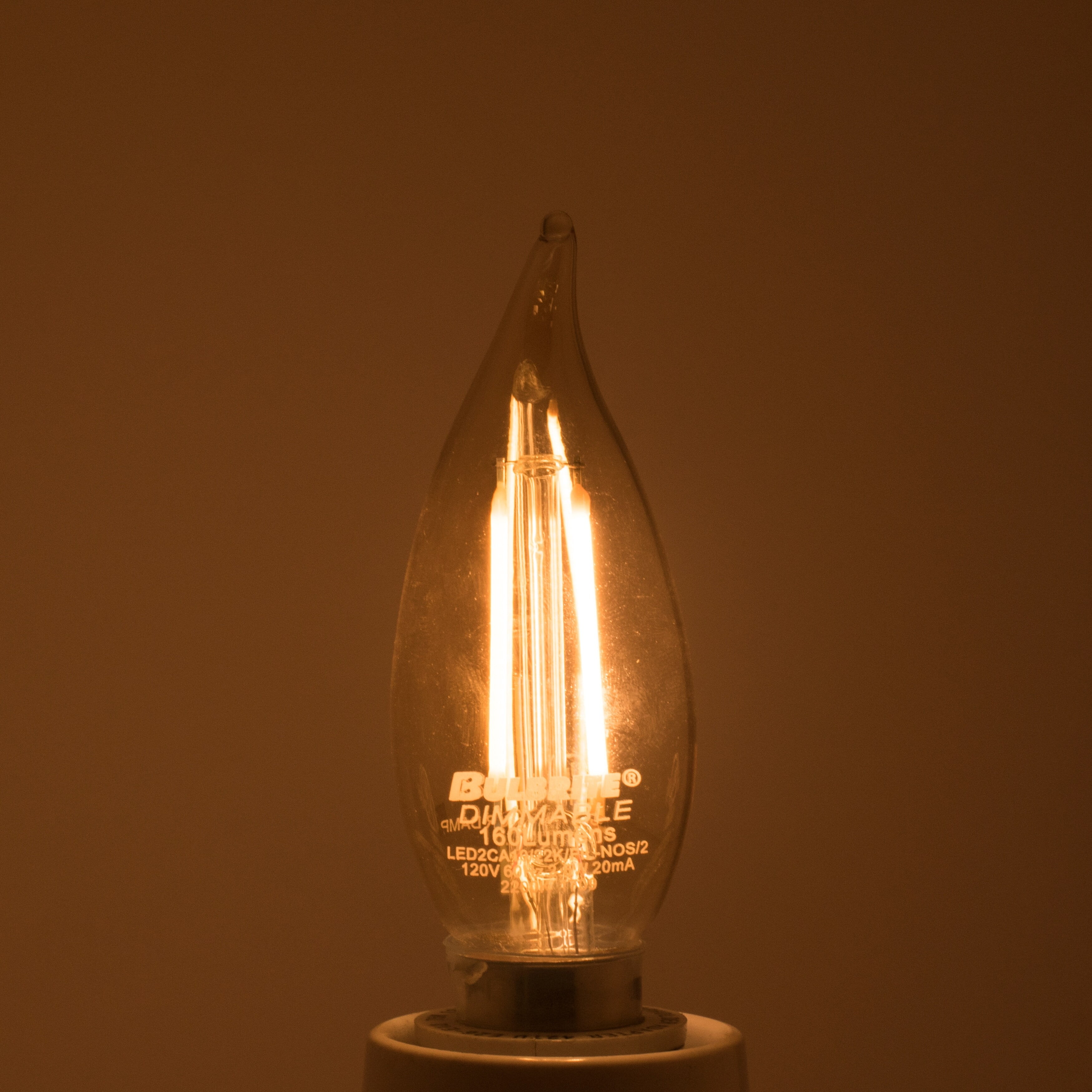 Bulbrite Pack of (4) 2.5 Watt Dimmable Antique Glass Finish CA10 LED Light Bulbs with Candelabra (E12) Base  2100K Amber Light  170 Lumens