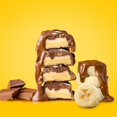 thumbnail image 5 of Barras de proteína del tamaño de un refrigerio FITCRUNCH, barra horneada de 6 capas, 4 g de azúcar, núcleo de pastel suave y sin gluten (9 barras, plátano y chocolate), 5 of 5