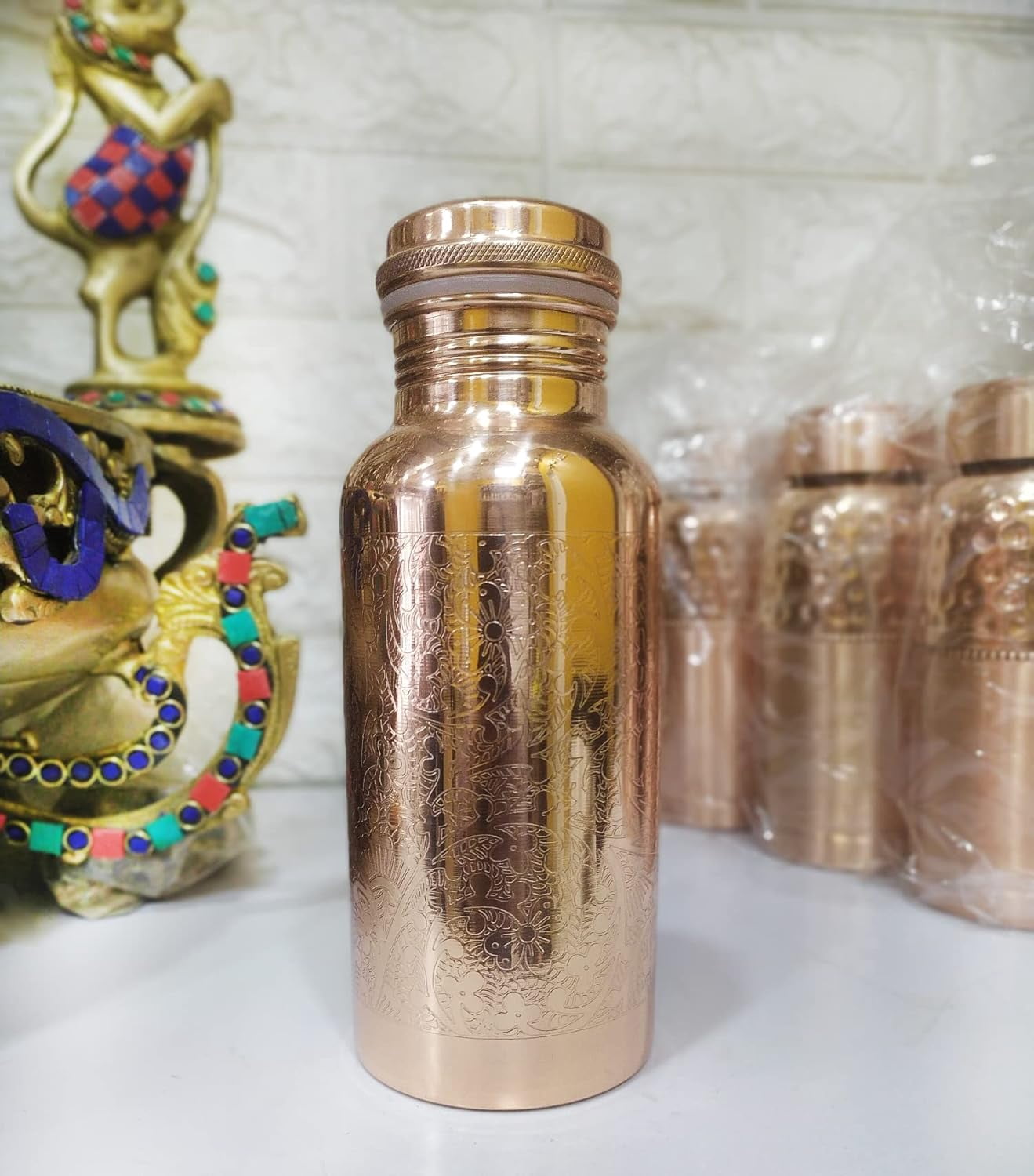 Buyerwell Pure Copper Embossed Water Bottle 17 Oz with Lid Ayurvedic Water Bottle Copper Water Vessel Small Leak Proof Seamless Finish