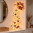 thumbnail image 4 of Festive Lighted Christmas Wall Decoration with a Red Gift Box with a Gold Bow, Cascading LED Hanging Pendant for the Hallway, Doorway and Staircase Wall Decor (Scarlet Gold), 4 of 5