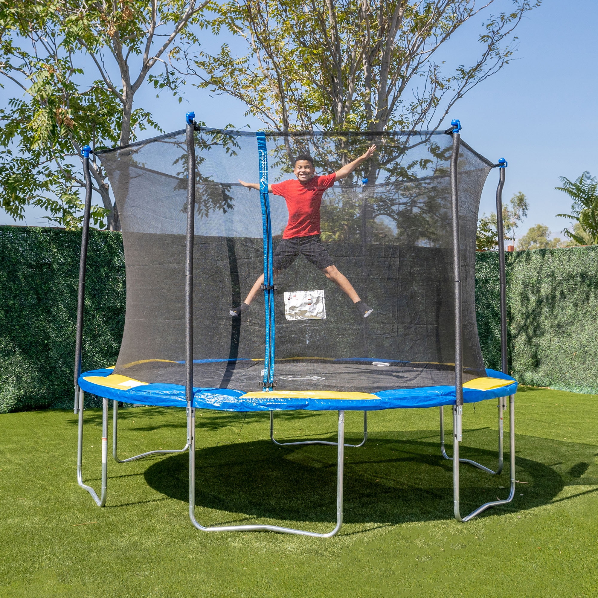 A kid jumping on the Bounce Pro 12 ft Trampoline.