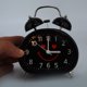 thumbnail image 3 of Lindo reloj despertador luminoso nocturno con cara sonriente, reloj despertador de doble campana, reloj de noche (negro), 3 of 9