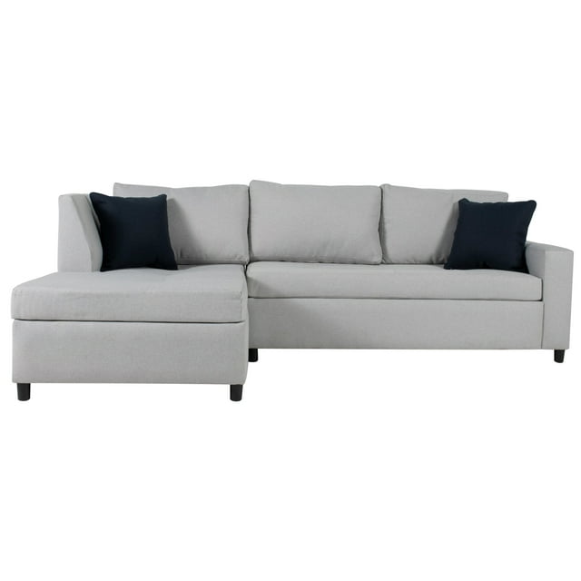 sala modular izquierda tarento gris sofá seccional con chaise izquierda, vista frontal 3/4; tapizado gris claro en poliéster, estructura de madera de pino con patas negras, asientos y respaldos acolchados con relleno de espuma de confort suave; incluye dos cojines oscuros. Adecuado también como área de descanso para lectura en espacios pequeños.