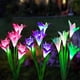 thumbnail image 1 of Luces solares para exteriores, paquete de 3 luces de hadas con diseño de flor de lis, LED que cambian de color para decoración de jardín, patio, paisaje y entrada (rosa, morado y negro)., 1 of 5