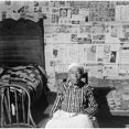 thumbnail image 2 of Elderly Former Slave In Her Sitting In Her News Papered Home In May 1941. The Beds Are Covered With Handmade Quilts., 2 of 2