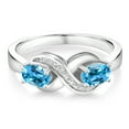 thumbnail image 2 of Gem Stone King 925 Sterling Silver Swiss Blue Topaz and White Created Sapphire Infinity Love Knot Ring for Women | 1.21 Cttw | Oval 6X4MM | Gemstone Birthstone | Jewelry Gifts for Mom Wife | Size 7, 2 of 5