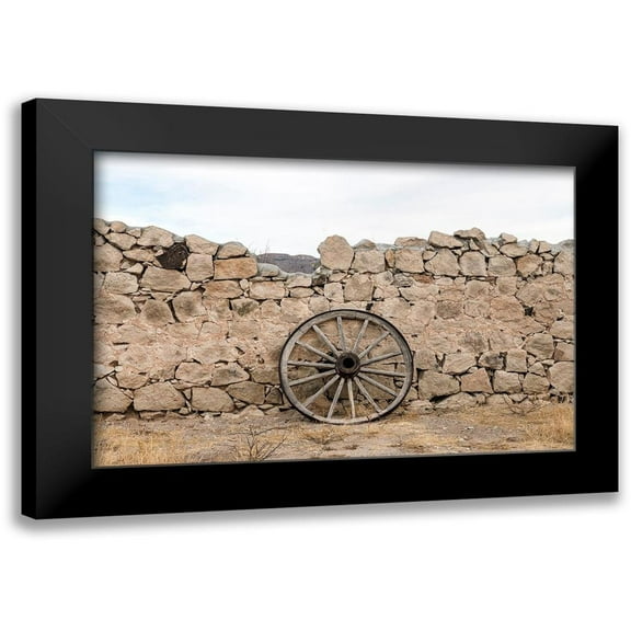 Highmith, Carol 14x11 Black Modern Framed Museum Art Print Titled - Wagon wheel against a stone fence at Hueco Tanks State Park, northwest of El Paso, TX