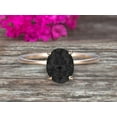 thumbnail image 1 of 1.25 Carat Classic Oval Black Diamond Moissanite And Moissanite Diamond Solitaire Engagement Ring on 10k Yellow Gold, 1 of 6