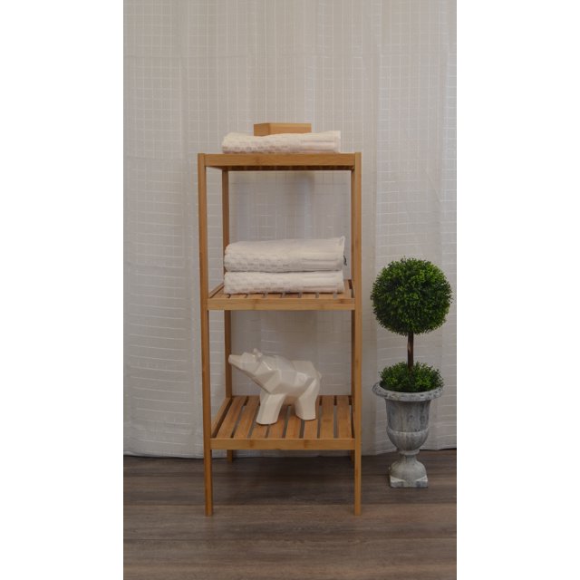 3 Tier Bathroom Tower Shelf Free Standing Bamboo by Nola Home & Furniture. This freestanding bamboo shelf features three spacious tiers with slatted surfaces, ideal for storing towels, toiletries, or decorative items. The natural bamboo finish complements various bathroom decors, creating a spa-like atmosphere. The shelf measures 31 inches in height, 13.4 inches in width, and 13 inches in depth, with an 11-inch distance between shelves. Displayed in a bathroom setting with towels, a decorative ceramic figure, and a potted plant.