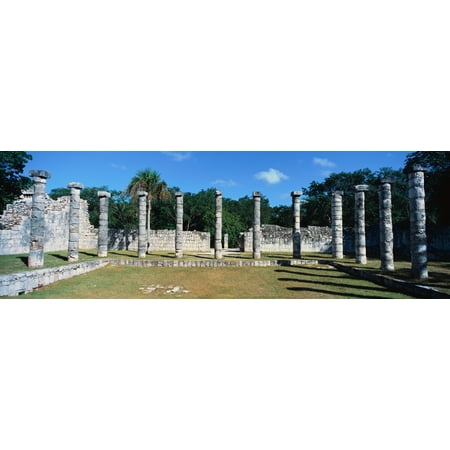 A panoramic view of columns surround grassy courtyard for ballgames at Chichen Itza Mayan Ruins in the Yucatan Peninsula Mexico Poster
