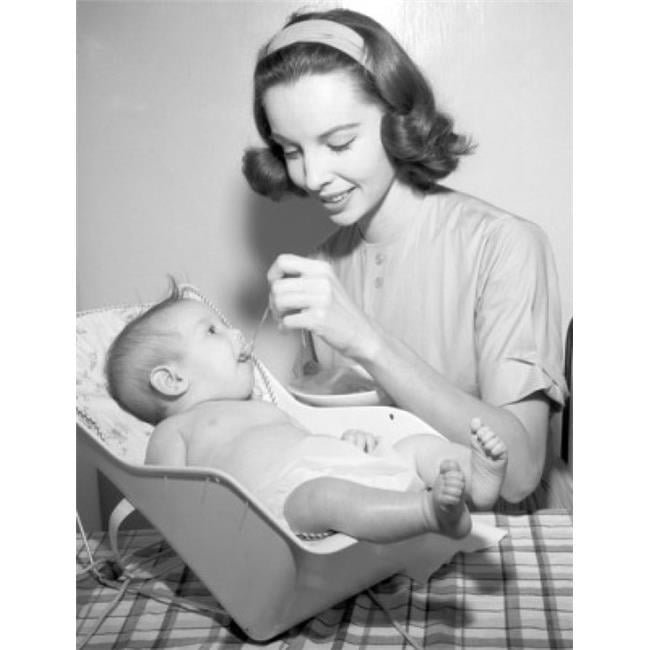 feeding baby in bouncer