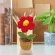 thumbnail image 2 of Maceta decorativa de lana tejida a mano con forma de rosa, ideal para el salpicadero del coche, el hogar, la oficina o como elemento decorativo sobre una mesa., 2 of 4