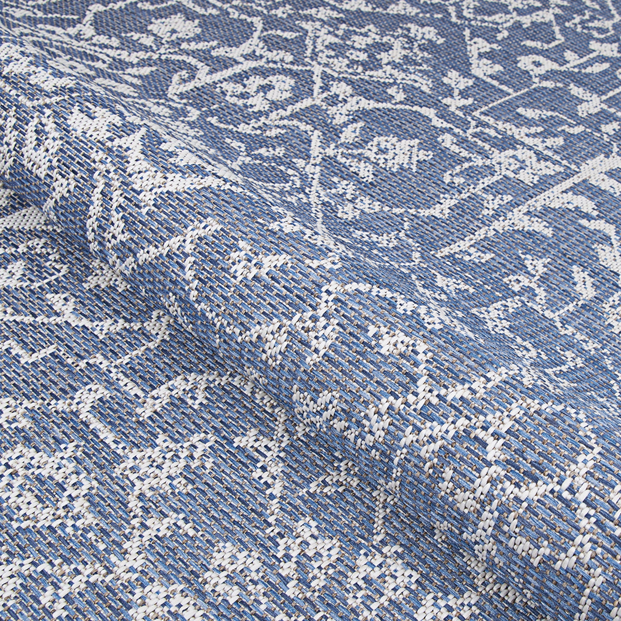 Couristan 5.5' x 9' Ocean Blue and Ivory Outdoor Floral Rectangular Area Throw Rug