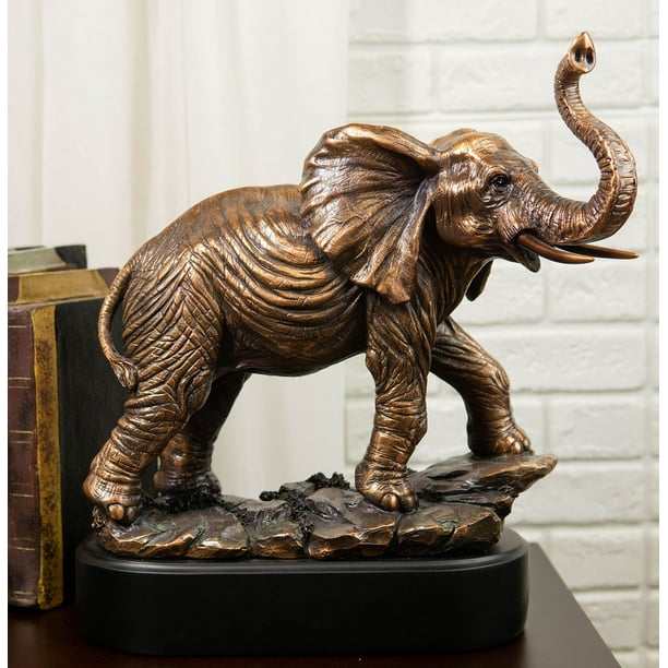 Large African Long Tusked Elephant Marching With Trunk Raised Statue