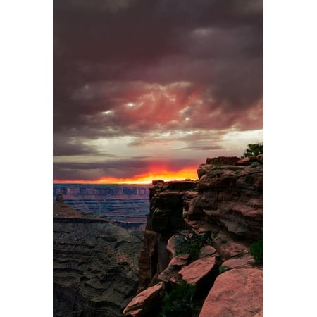 Horse Clip Point - Red sunset with moody clouds and red rock canyons in Dead Horse Point State Park near Moab, Utah Print Wall Art By David Chang