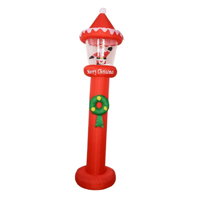 papá inflable navideño, decoración de patio, adorable, decoración de patio con iluminación led para exteriores, inflable navideña Vista frontal centrada de un Papá Noel inflable rojo de 270 cm con base circular y columna alta, parte superior tipo farol iluminada que contiene una figura navideña, columna con corona verde aplicada, luces LED integradas, incluye adaptador 110 V; ideal para jardín y porche durante la temporada navideña.