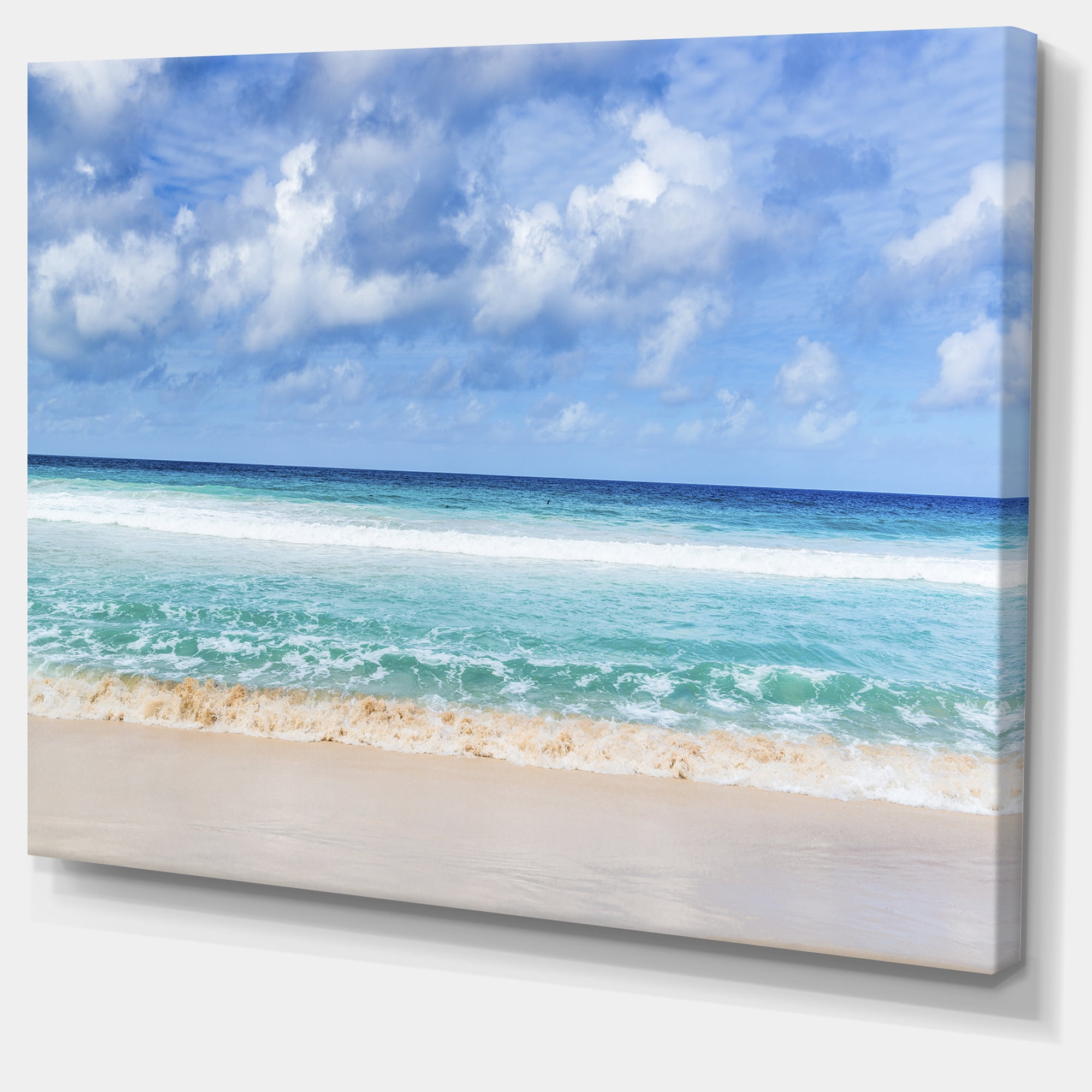 Designart 'Tranquil Beach under White Clouds ' Modern Seascape Canvas Artwork