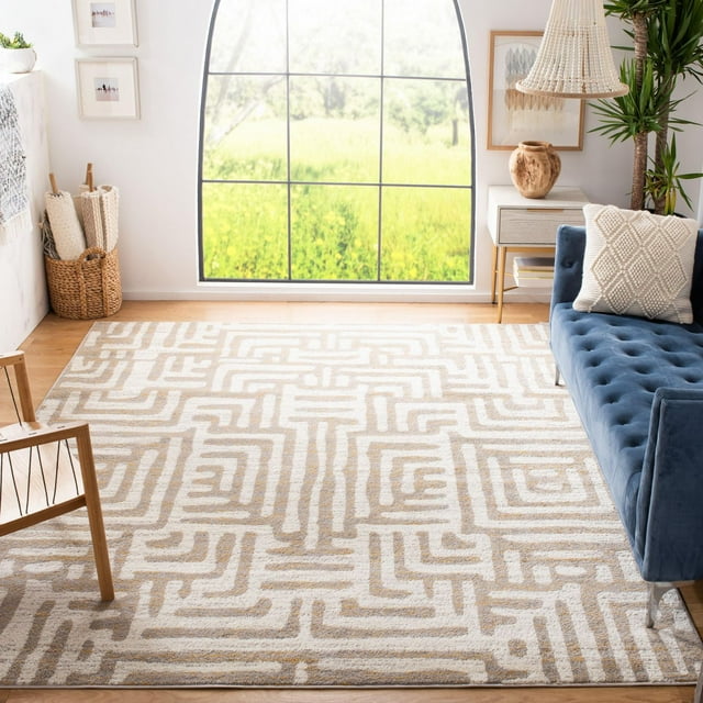 SAFAVIEH Amsterdam Elvan beige and white geometric area rug displayed in a modern living room with blue velvet sofa, wooden chair, woven basket, and large arched window.