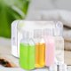 thumbnail image 2 of Juego de 4 botellas de viaje transparentes de 100 ml, adecuadas para artículos de aseo, portátiles, recargables, a prueba de fugas, accesorios de viaje, champú, acondicionador, tónico., 2 of 5