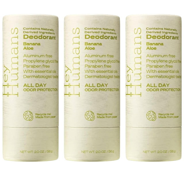 desodorante hey humans sin aluminio para mujeres y hombres envase stick de papel reciclable color crema con texto verde, vista frontal centrada de tres unidades que muestran 'Banana Aloe', 'Aluminum free', 'Paraben free' y 'All day odor protection', net wt. 2.0 oz (56 g); también suele usarse como desodorante de bolsillo para viaje por su tamaño compacto.