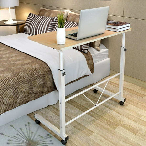 Raise the table to accommodate a hospital bed or lower it to allow the patient to use the surface while sitting in a chair. mobile laptop desk cart stand sofa bedside table adjustable height workstation with wheels for home office yellow