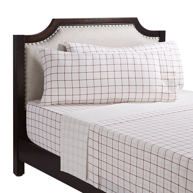 Holiday Time queen sheet set featuring 4-piece holiday plaid flannel sheets in white with red grid pattern on a bed with dark wood frame.
