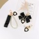 thumbnail image 4 of LLavero de amor negro Retro para mujer y niña, colgante nacarado con lazo, funda para auriculares, adorno, llaveros, regalo para pareja, 4 of 4