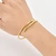 thumbnail image 3 of Brazalete Pulsera Ryscom Forma de Espiral con Dije de Corazon Color Dorado Acero Inoxidable, 3 of 5